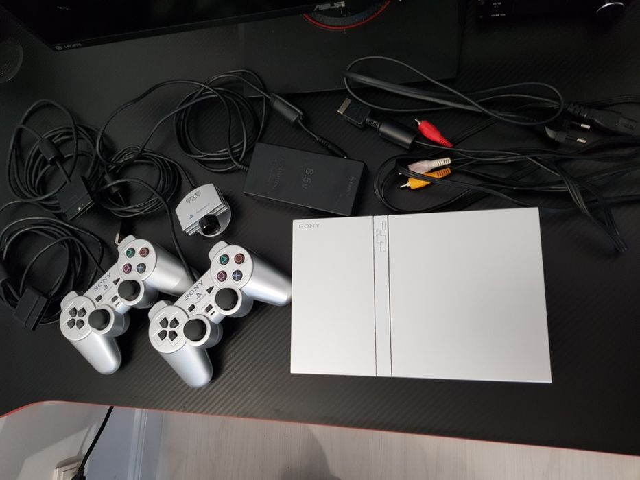 PlayStation 2 Slim Silver - 2 manete originale + Cameră EyeToy set complet