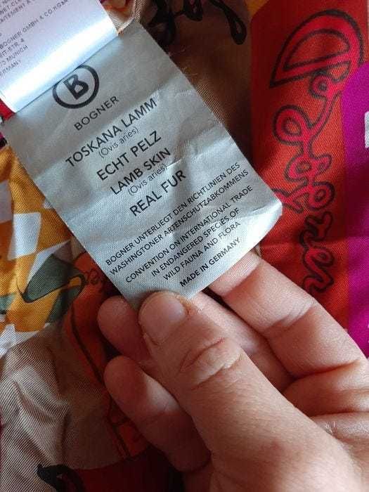 Geaca Bogner cu umplutura de puf si piele  de miel in stare f buna