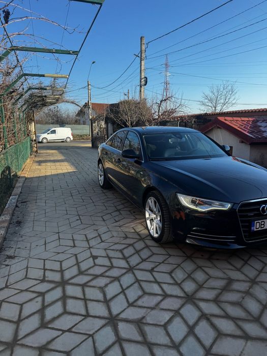 Vand Audi A6 automat,culoare albastra,interior gri cu piele alcantara.
