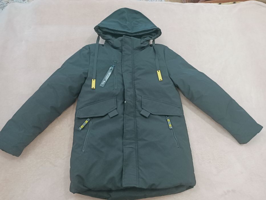 Продам новый пуховик для мальчика 9-11 лет