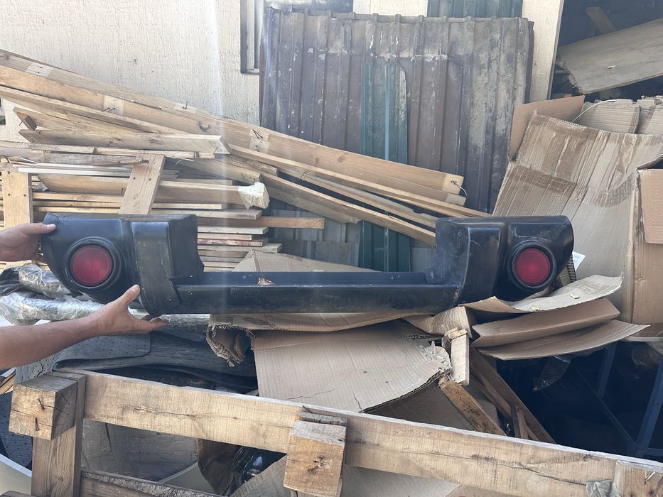 Задний бампер L200