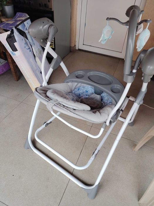 Balansoar electric de bebeluși