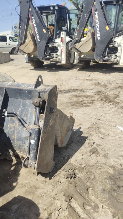 Погрузчик  эксковатор.3в1