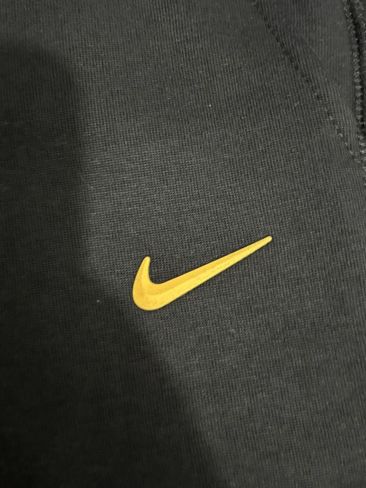 Pantaloni Nike NOCTA negri – noi, cu etichetă