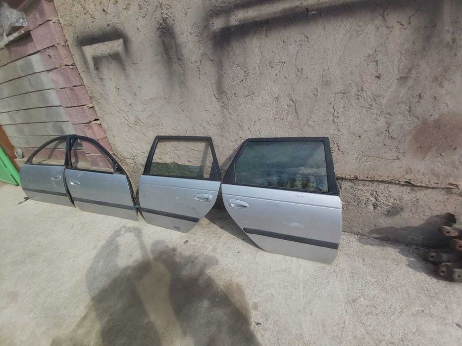 двери на toyota avensis 2000г