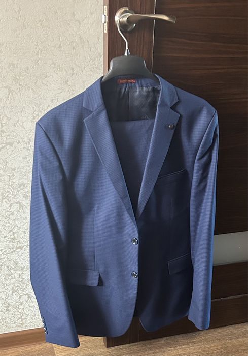 Костюмы 50-52р 15000