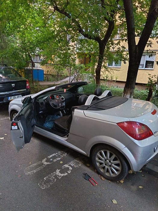 Vând Opel Tigra,  1.4 benzina, decapotabilă.