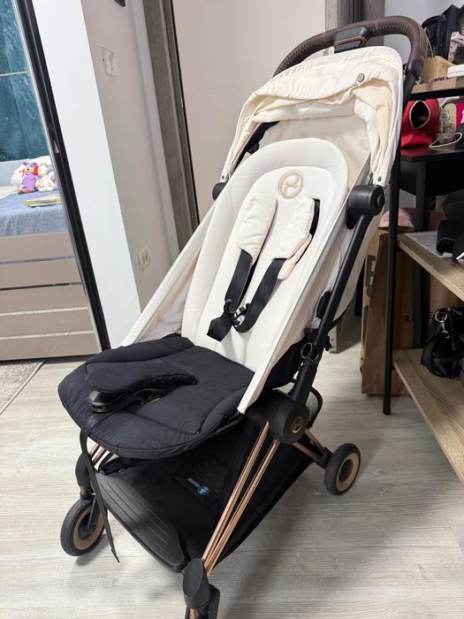 Cărucior Cybex Coya Platinum – Alb / Rose Gold – Stare excelentă