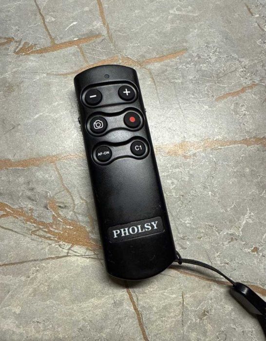 PHOLSY RMT-P1BT telecomandă Bluetooth, ca nouă