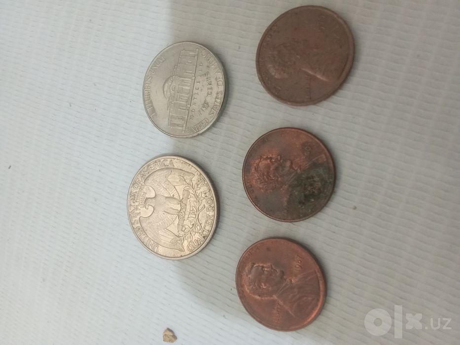 Монеты one cent, five cent и quarter dollar