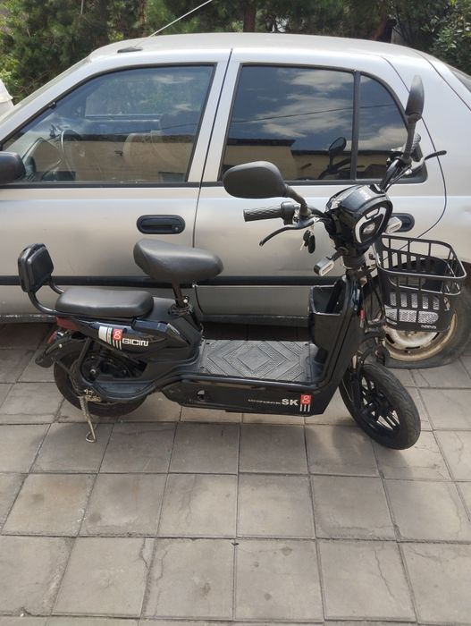 Электроскутер На ходу.