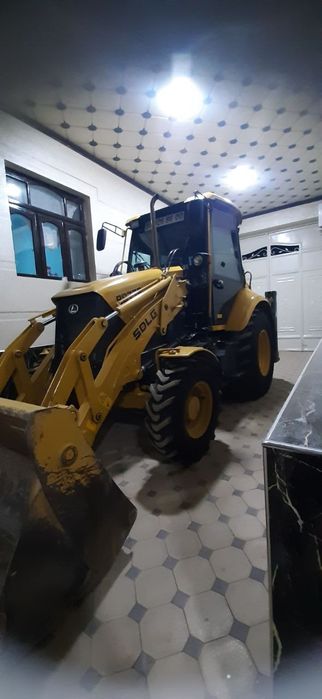 Экскаватор погрузчик Volvo SDLG