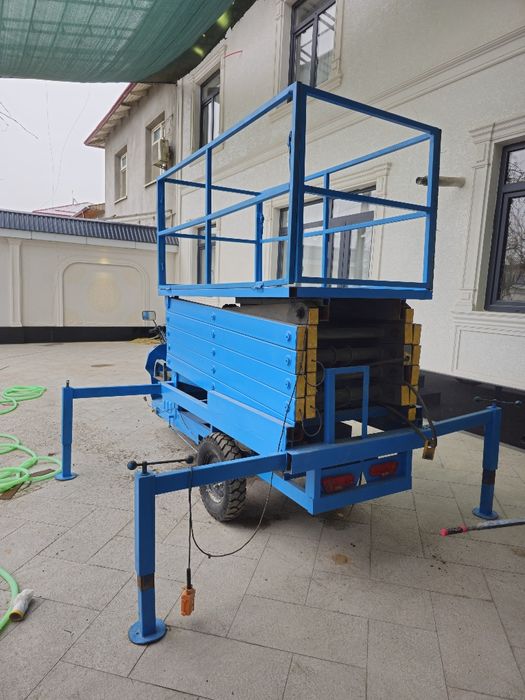 9 m elektr uch g'ildirakli velosiped qaychi ko'taruvchi