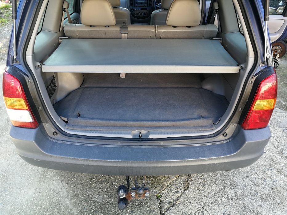 на части Mazda Tribute 2.0