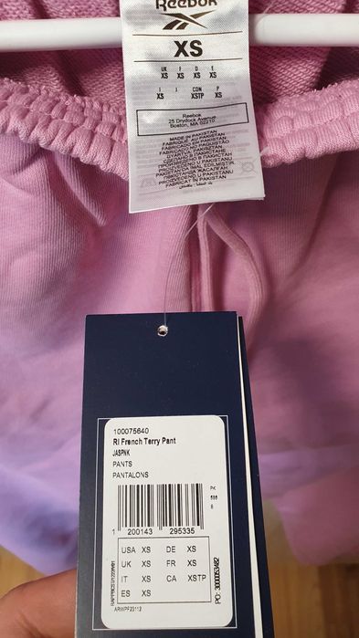 Pantaloni trening femei roz 100075640 Reebok FRENCH TERRY marimea XS