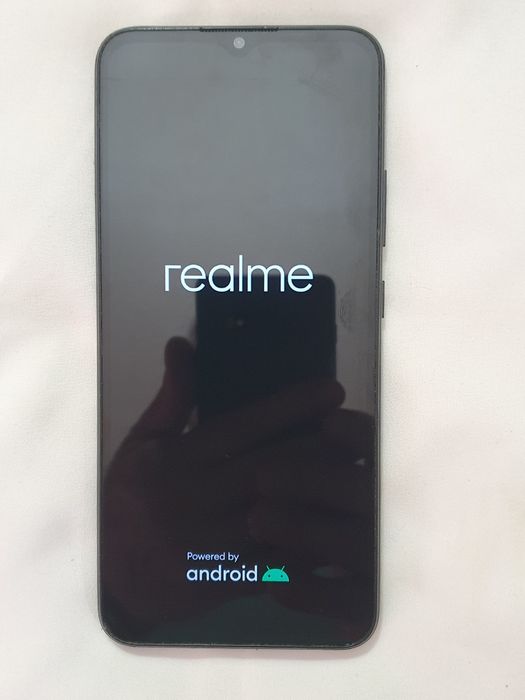 Tel. Realme C21.