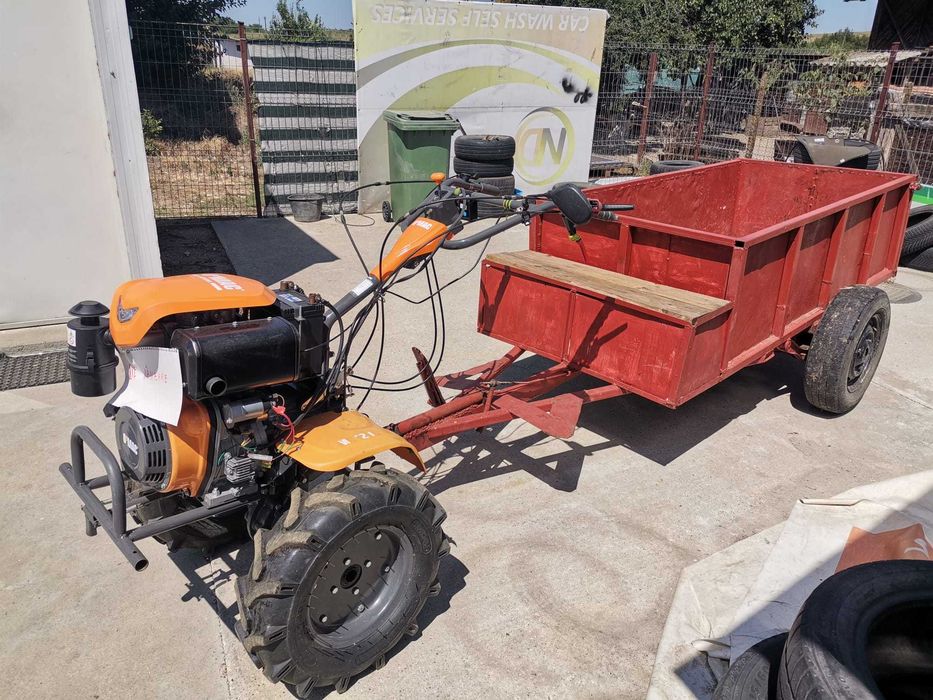 Motocultor O'MAC MC 12000E-D echipat cu remorca foarte incapatoare cu frana de picior