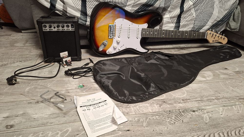 Vând chitara electrica cu amplificator