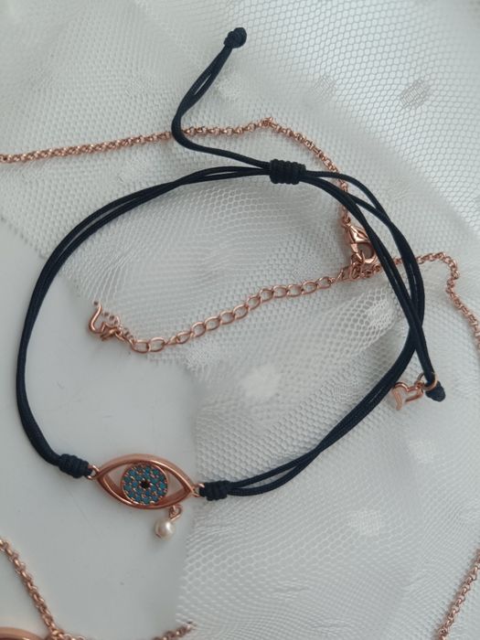 Комплект на Oxette колие и гривна в розово злато със синьо око