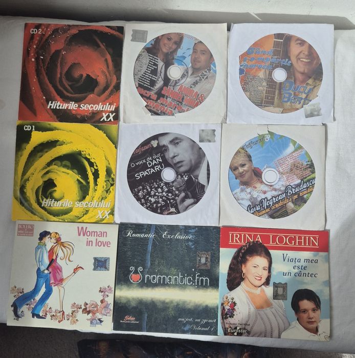 9 CD muzică românească și internațională.