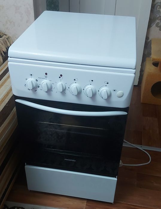 Продам комбинированную газовую плиту с эл. духовкой