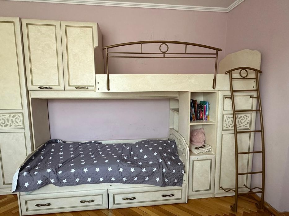 Продам двухъярусную кровать со шкафом, столом и полками.