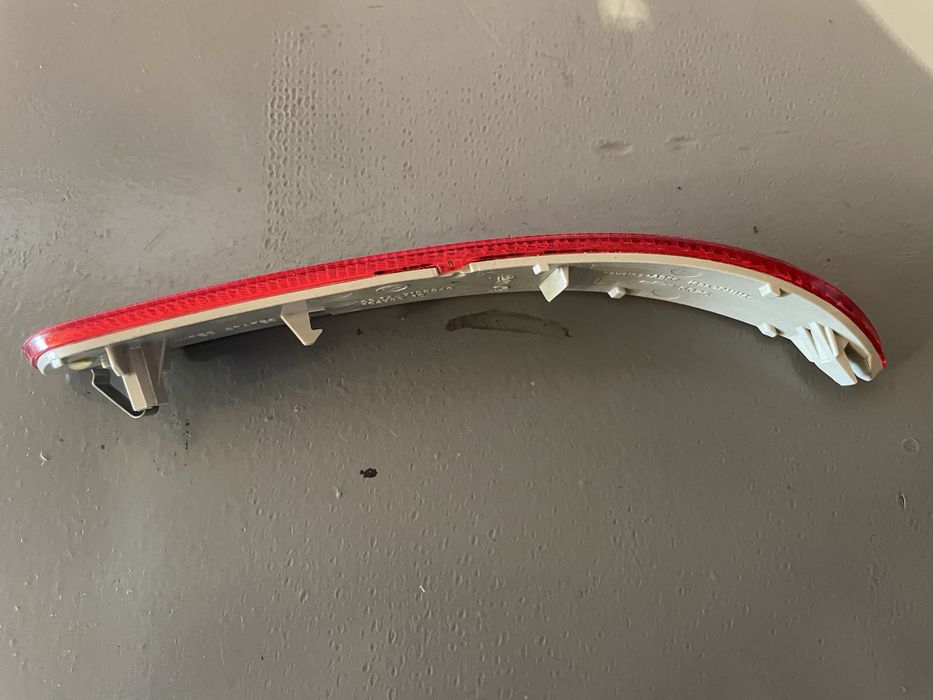 Отражатель заднего бампера е70 дорестайлинг, левая