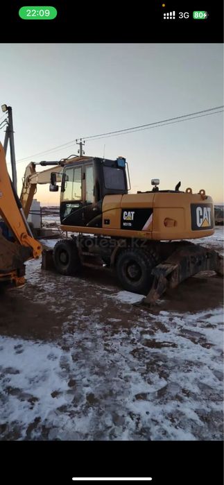 Колесный экскаватор