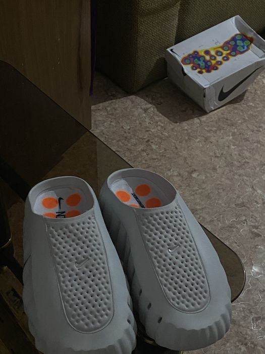 Продам тапочки nike mind 001