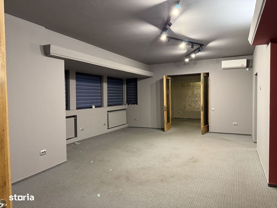 Apartament cu garaj, grădină, aer conditionat și centrală proprie