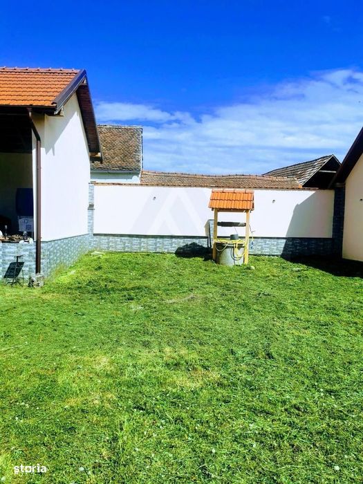 Casa individuala cu garaj 60 mp si teren+gradina 2650 mp in Porumbacu
