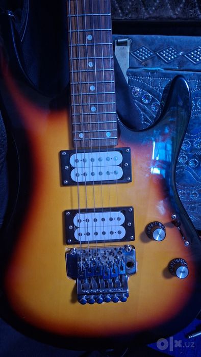 Solo elektro Gitara olgan odam baraka topadi.