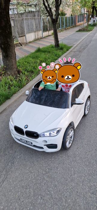 Mașinuța electrica BMW X6M 2 locuri
- centură de
