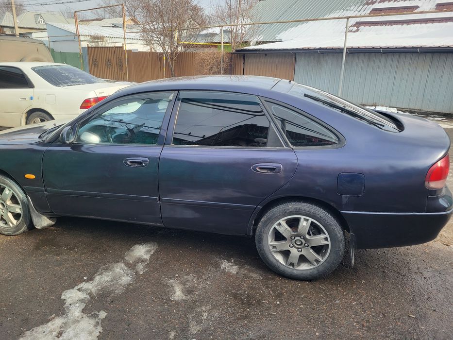 Автомобиль мазда кронос