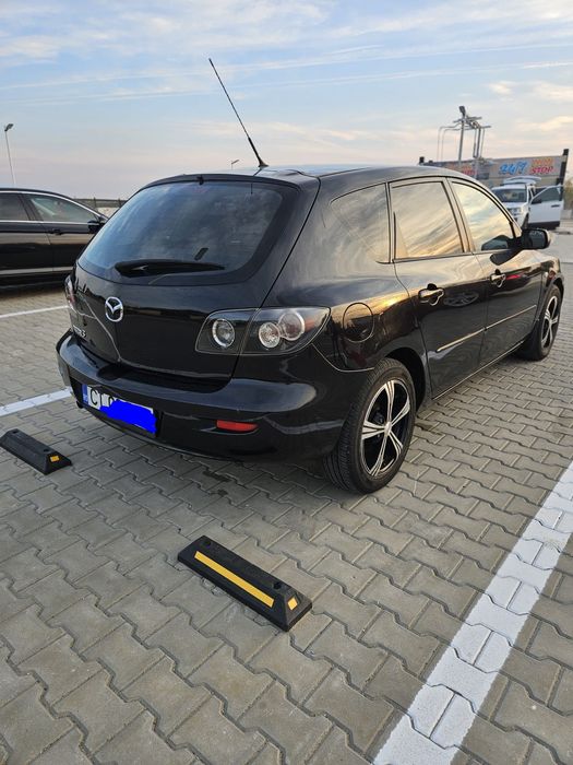 Vând mazda 3  Hatchback motor 1.3 benzina  an 2008