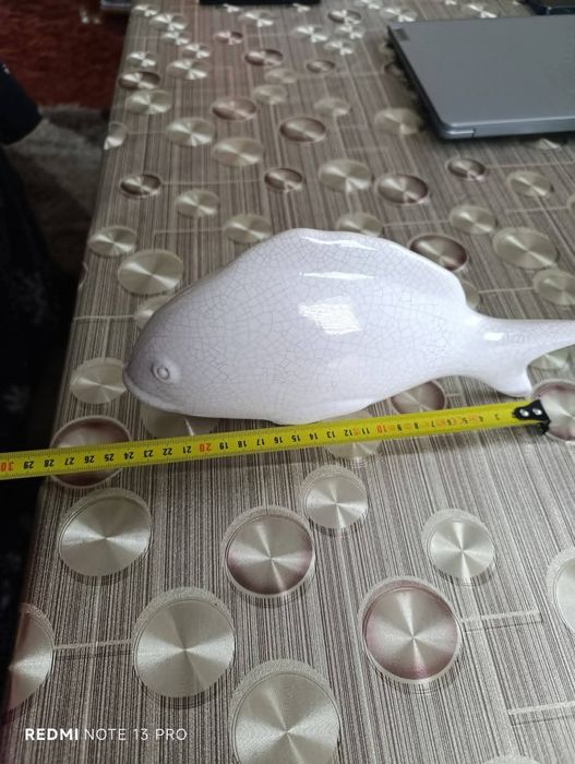 Стара статуетка на риба