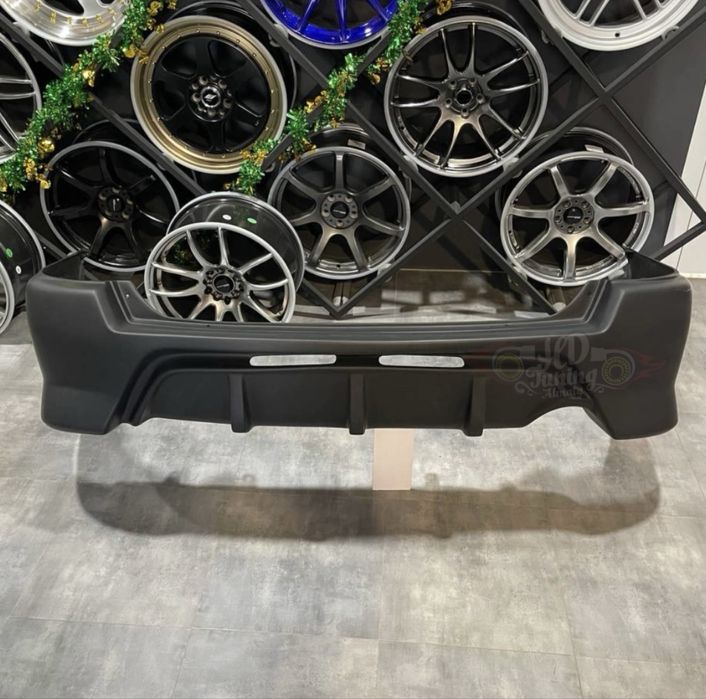 Бампер задний Toyota Caldina