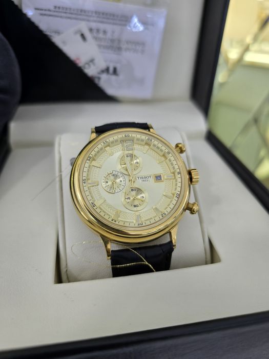 Продам золотые часы Tissot 750 пробы