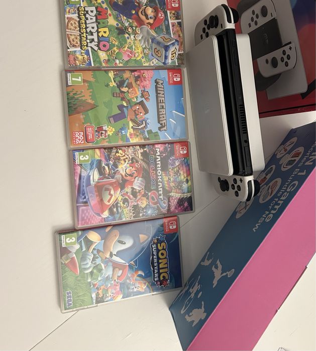 Nintendo Switch OLED + 4 jocuri + accesorii | aproape nou