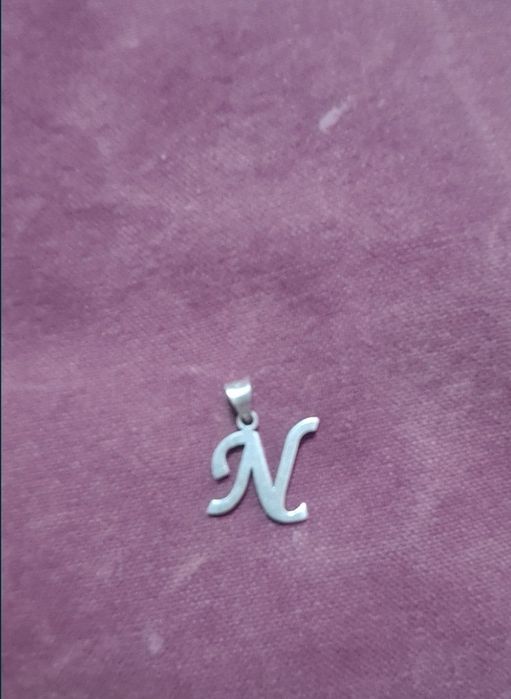 Vând inițială argint