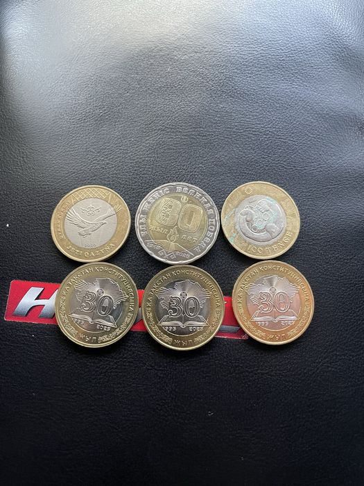 Монеты 100 ,200 тнг колекционные