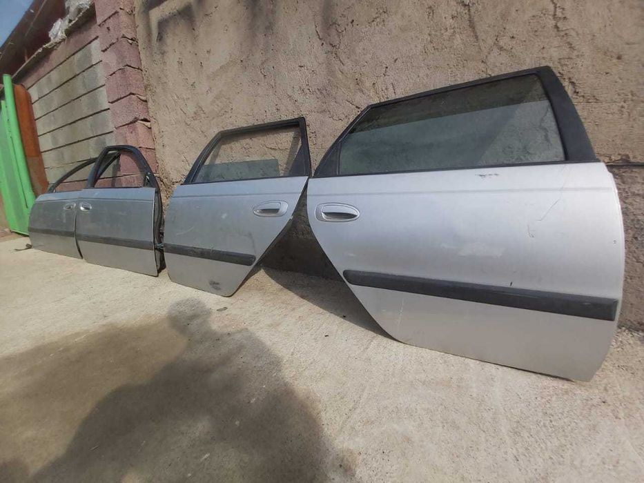 двери на toyota avensis 2000г