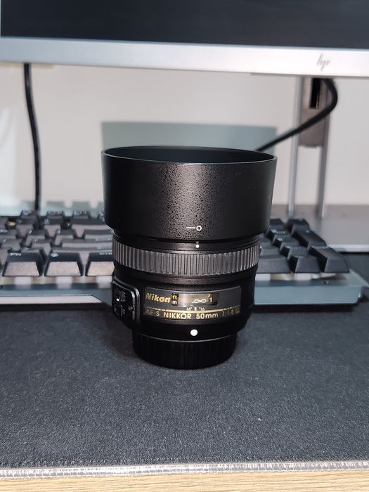 Nikon 50 mm f1.8 Nikkor 50 mm F1.8 като нов
