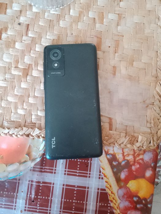 Telefon Tcl mobil si casti