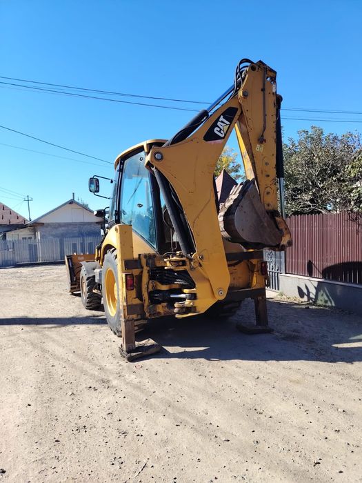 Vând buldoexcavator Caterpillar
