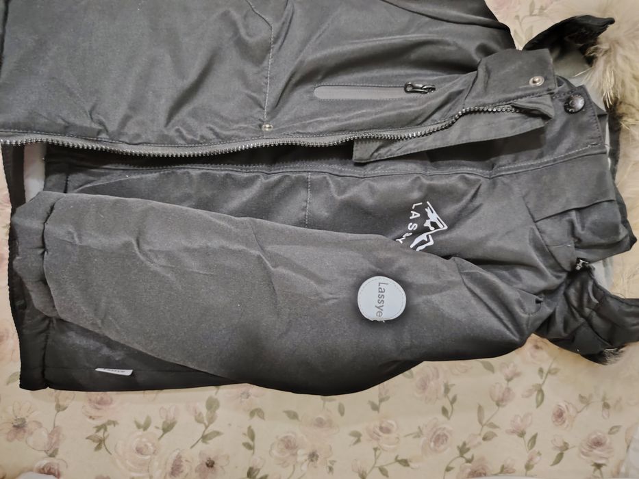 Продам новый  зимний комбинезон