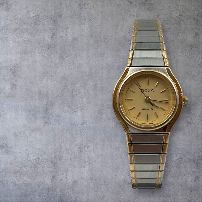 Doxa дамски швейцарски часовник с позлата