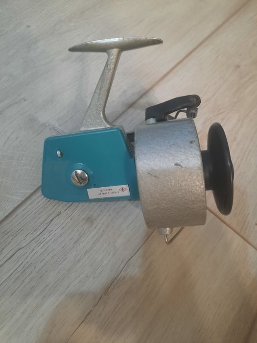 Катушка спиннинговая дельфин