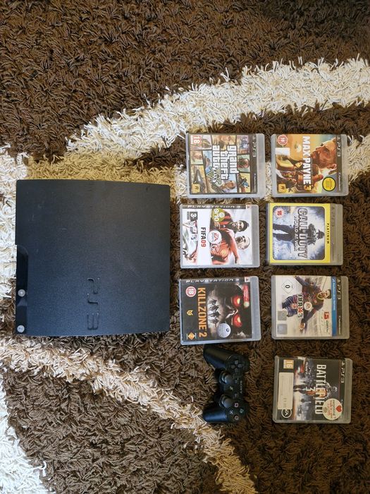 PlayStation 3  cu o maneta dual shock si cu 7 jocuri