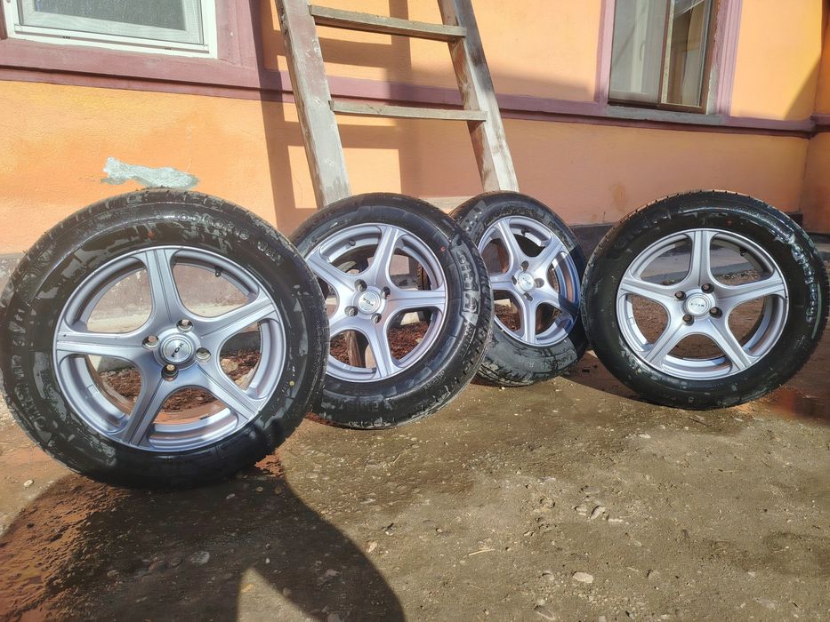 Jante 4x100 r15 cu cauciucuri de vara 185-65-r15 aproape noi